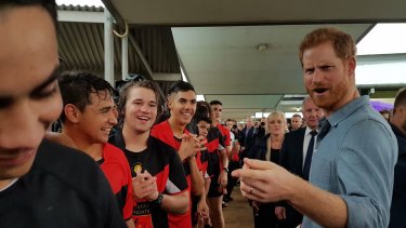 Prince Harry banters with Clontarf Foundation footballers at Dubbo College
