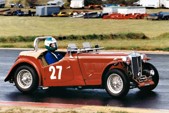 Danny Richards with his red 1949 MG-TC. 