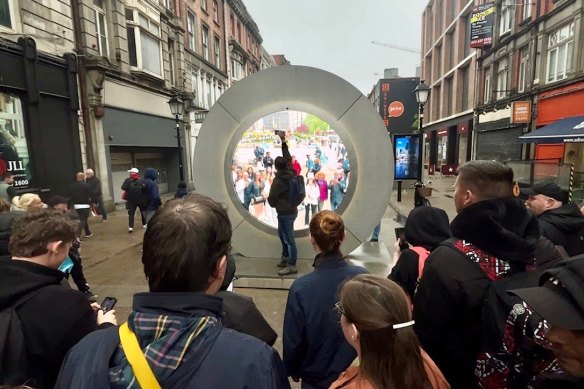 People view the live stream portal between Dublin and New York which was temporarily closed following some “inappropriate behaviour” in the Irish capital.
