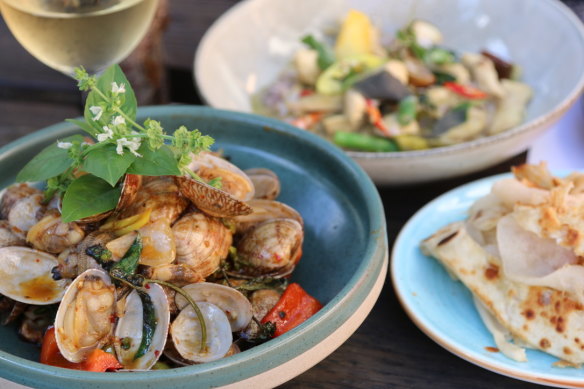 Pipis stir-fried with morning glory, chilli, Thai basil and more.