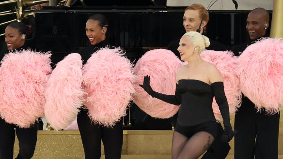 Lady Gaga performs during the athletes’ parade on the River Seine during the opening ceremony. 