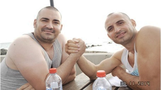 Brothers in arms: Bekim Zogaj (aka Aniello Vinciguerra) and George Nika pose for a photograph during a rest stop in South Australia in November 2014. 
