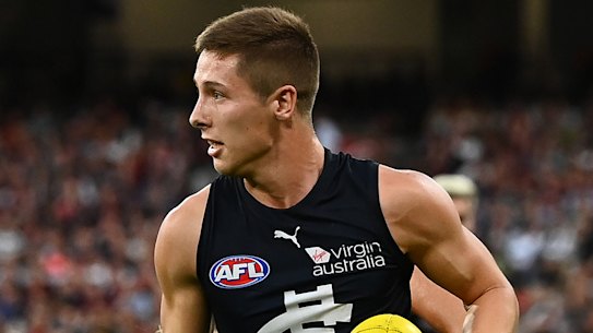 Lachie Fogarty avoids a Dyson Heppell tackle in Carlton’s win over the Dons.