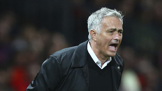 Anguish: Jose Mourinho tries to get a message across during the heavy defeat.
