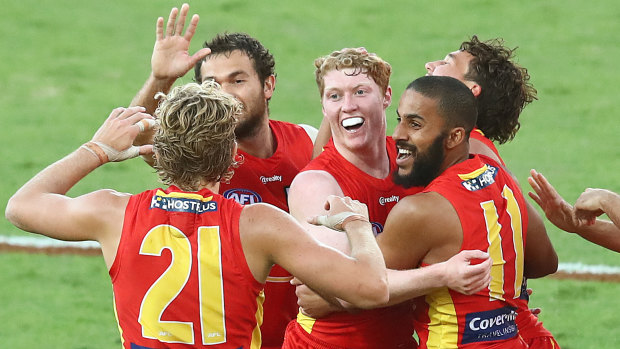 Shining light: Matt Rowell (centre) was in top form again for the Gold Coast Suns.