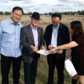Humphrey Xu, left, in a newsletter sent by Daryl Maguire in 2013. He was in Wagga amid talks over the proposed $400 million development. Also pictured is Wagga council general manager Phil Pinyon, Wang Jian and Lydia Zhang. 