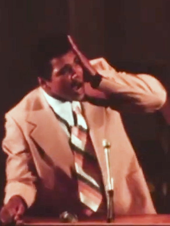 Muhammad Ali delivers a speech at Harvard in 1975.