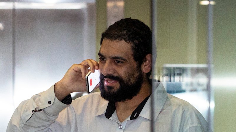 Alleged kickback mastermind joked about getting ‘hitman’ to deal with official