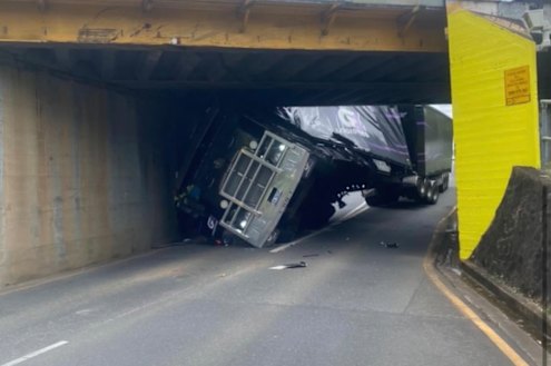The truck wedged beneath the Oxley Road overpass in Sherwood on Wednesday.