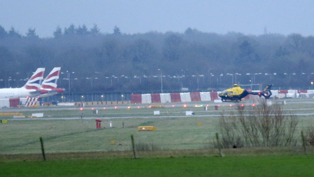 Grounded planes and helicopters at Gatwick.