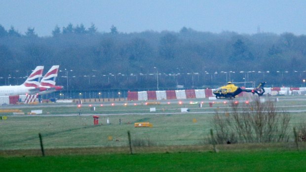 Grounded planes and helicopters at Gatwick.