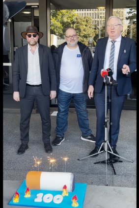 Butt really? Libertarian MP David Limbrick (right) and the cake in question.