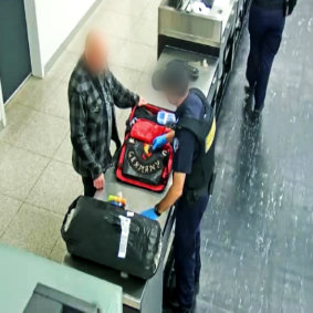 The 61-year-old German Gypsy Jokers member has his luggage inspected at Perth Airport. 