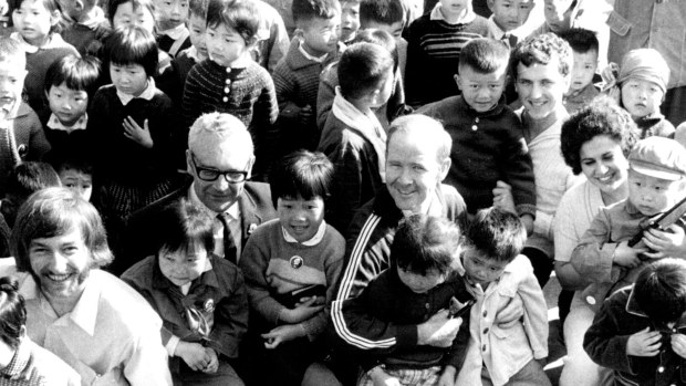 A file pic dated May 5, 1971, of members of the Australian table tennis team surrounded by children at the Morning Sun workers’ village on the outskirts of Shanghai. They are (from left) Stephen Knapp, 17, of Doncaster, Dr. John Jackson, coach Noel Shorter, of Sydney, Paul Pinkewich, 20, of Sydney and Ann McMahon, 19, of Adelaide.   