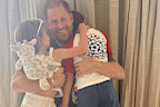 The Duchess of Sussex shared this photo of Prince Harry and their children to mark the occasion.
