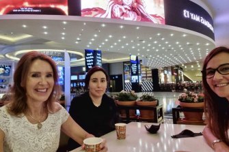 The unverified image that is believed to show Princess Latifa (centre) at a Dubai mall cafe.  