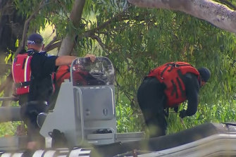 Divers searching for a ute swept away in floodwaters later found a 73-year-old man trapped inside.