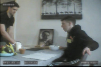 A portrait of Adolf Hitler at the breakfast table inside Racism HQ.