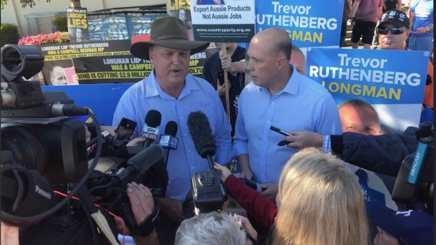 Federal Immigration minister Peter Dutton (Dickson) campaigns with Trevor Ruthenberg in his neighbouring seat of Longman during the Super Saturday election.