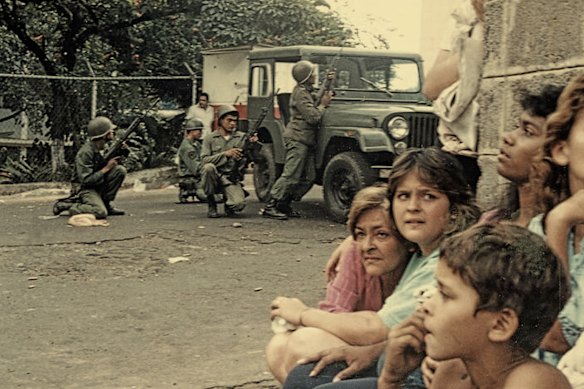 Women and children shelter during riots in Caracas in 1989.  
