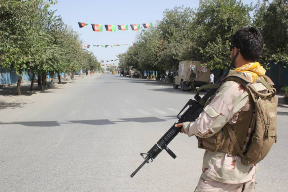 Afghan security forces stand guard during a fight against Taliban fighters in Kunduz province, north of Kabul.