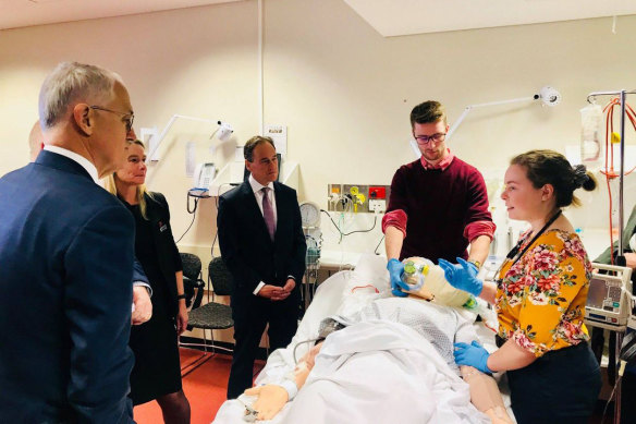 University of Tasmania medical students with Malcolm Turnbull, Greg Hunt and Liberal candidate for Braddon Brett Whiteley (obscured) in Burnie  in June 2018.