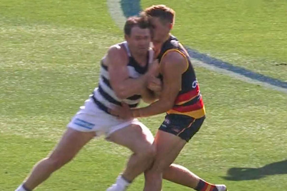 Patrick Dangerfield, left, collides with Crows defender Jake Kelly. 