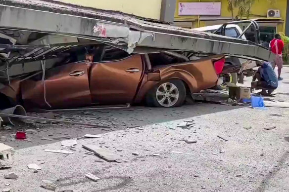 A screengrab from a video uploaded to social media shows damage to a vehicle and building in Vanuatu after a magnitude-7.3 earthquake on Tuesday.