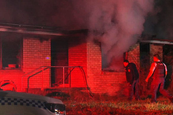 A woman died and a man and two children remain in hospital after a fire ravaged their home in Orange.