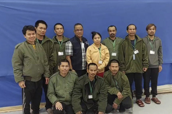 In this photo provided by Thailand’s Foreign Ministry, 10 freed Thai hostages and an officer, fourth from the left, pose for a photo at Israel’s Shamir Medical Centre.