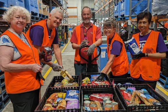 Foodbank Queensland volunteers at the food distribution warehouse in Brisbane. 