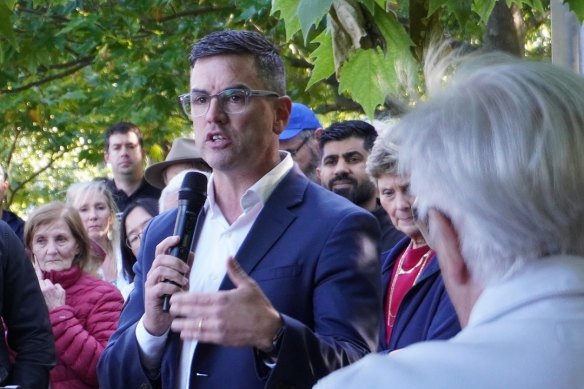 Liberal MP Brad Battin speaking on Tuesday at a protest over renaming a lake in Berwick.