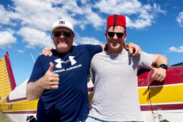 Zach Bray (right) and his father Adam celebrate after Zach passed his private pilot’s licence test in 2021.