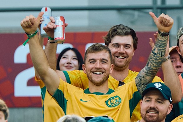 Injured Socceroo Riley McGree in the stands at the FIFA World Cup.