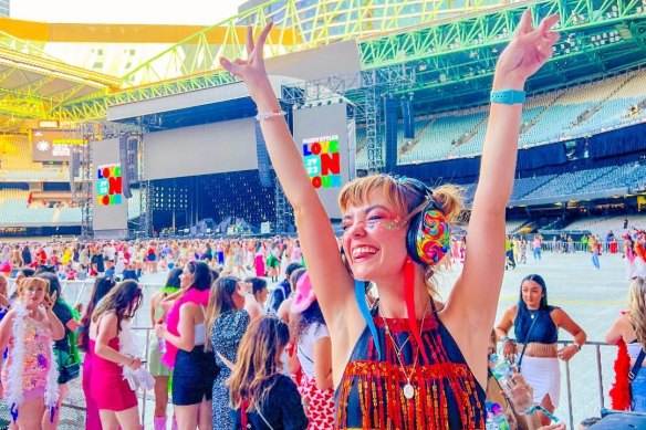 Heartbreak High star Chloe Hayden, who is neurodivergent, wearing a pair of headphones at Harry Styles’ Melbourne concert last year.