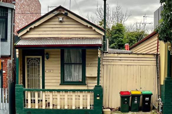 The tiny house in North Melbourne where a family of eight once lived.