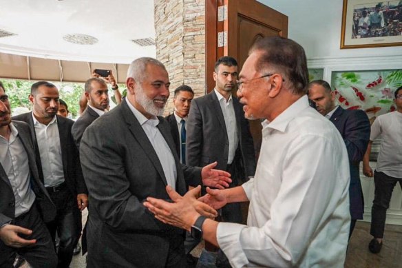 A photo of Hamas leader Ismail Haniyeh (left) and Anwar posted on Facebook by the Malaysian leader last week after a phone conversation between the pair.