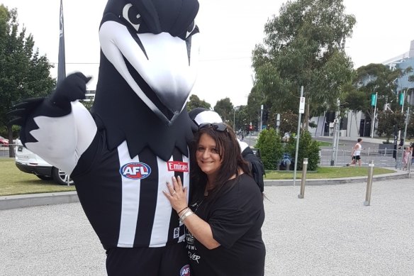 Collingwood cheer squad leader Voula Bitsikas says she's devastated to miss her team's round 2 match against Richmond.
