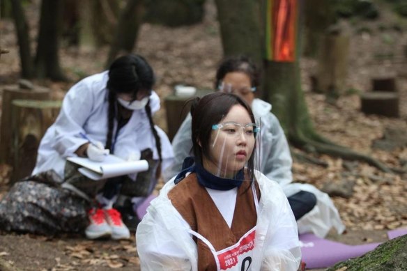 Participants in the annual Space Out Competition in a forest on South Korea’s Jeju island. 