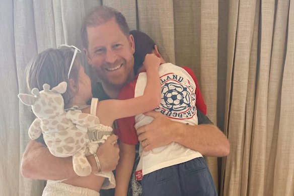 A photo released last month for Father’s Day in the US/UK of Harry with Archie and Lilibet – who have not seen their grandfather, King Charles, for four years. 