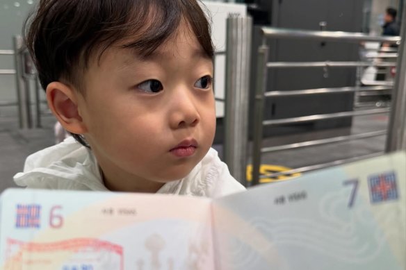 Ko Yoonwoo with his passport.