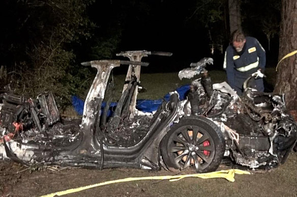 The wreck from the latest Tesla crash.. Authorities said that one man was found in the front passenger seat and a second in one of the rear seats - with no sign anyone was behind the wheel.