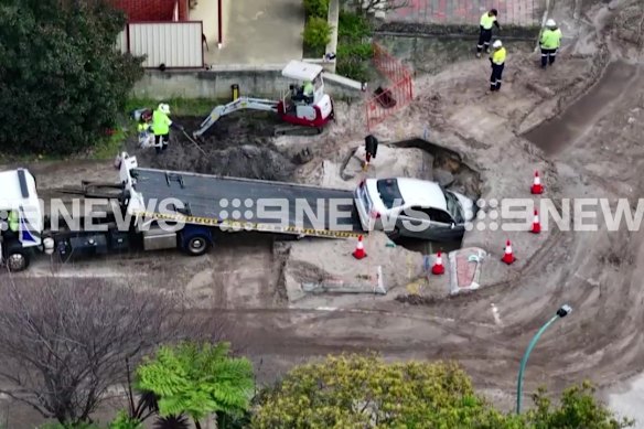 A tow truck has been called in to remove a car from a sinkhole in Perth’s south-east.