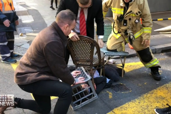 In 2019, Jamie Ingram (red tie) knocked Mert Ney to the ground, and Jason Shore held him down using a milk crate.