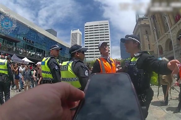 Police moving protesters from Forrest Place in Perth on Monday.