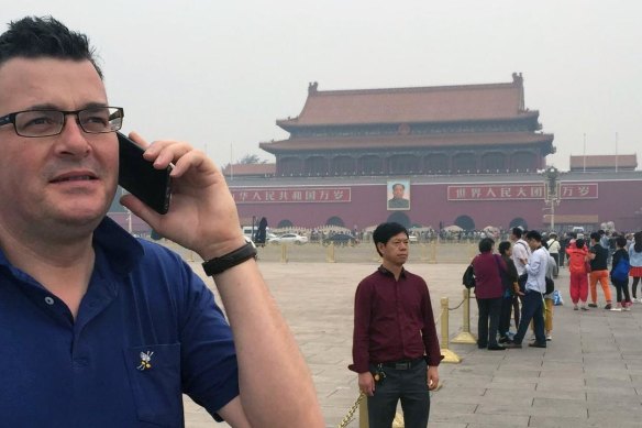 Daniel Andrews in Tiananmen Square during a visit to China in 2015 – an image that would become a popular meme format for fans and foes alike.