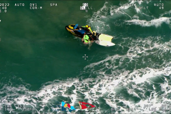 Rescue helicopter vision of Geelong footballer Patrick Dangerfield rescuing an 11-year-old girl in the surf at Moggs Creek on Sunday.