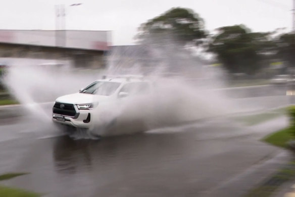 A car drives through floodwaters at Taren Point in Sydney’s south.