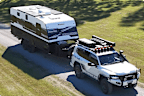 An SUV towing a caravan made by Essential Caravans.