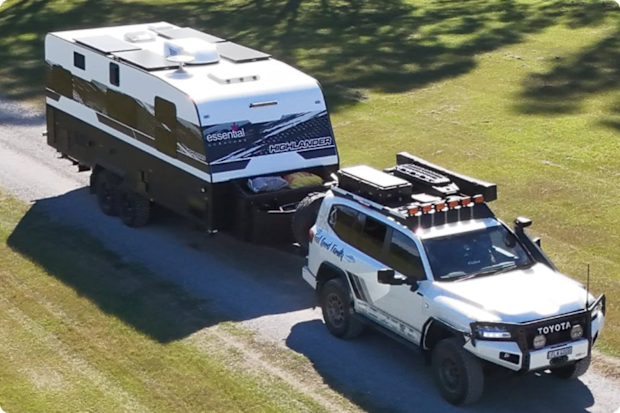 An SUV towing a caravan made by Essential Caravans.